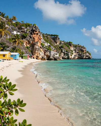 Crystal clear turquoise water and dramatic cliffs at a secluded beach in Curaçao Dutch Caribbean