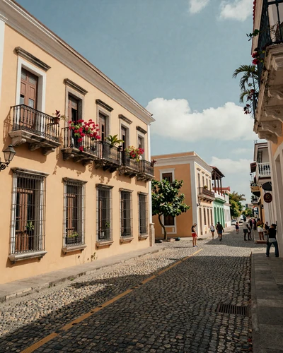 Colorful Zona Colonial street in Santo Domingo Dominican Republic with colonial architecture and tropical flowers